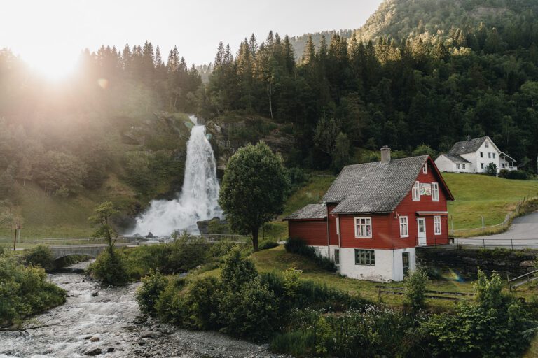 Waterfall in a green valley in Norway