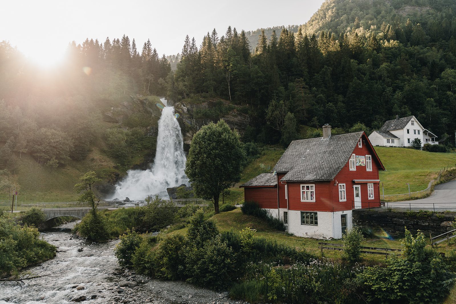 Waterfall in a green valley in Norway