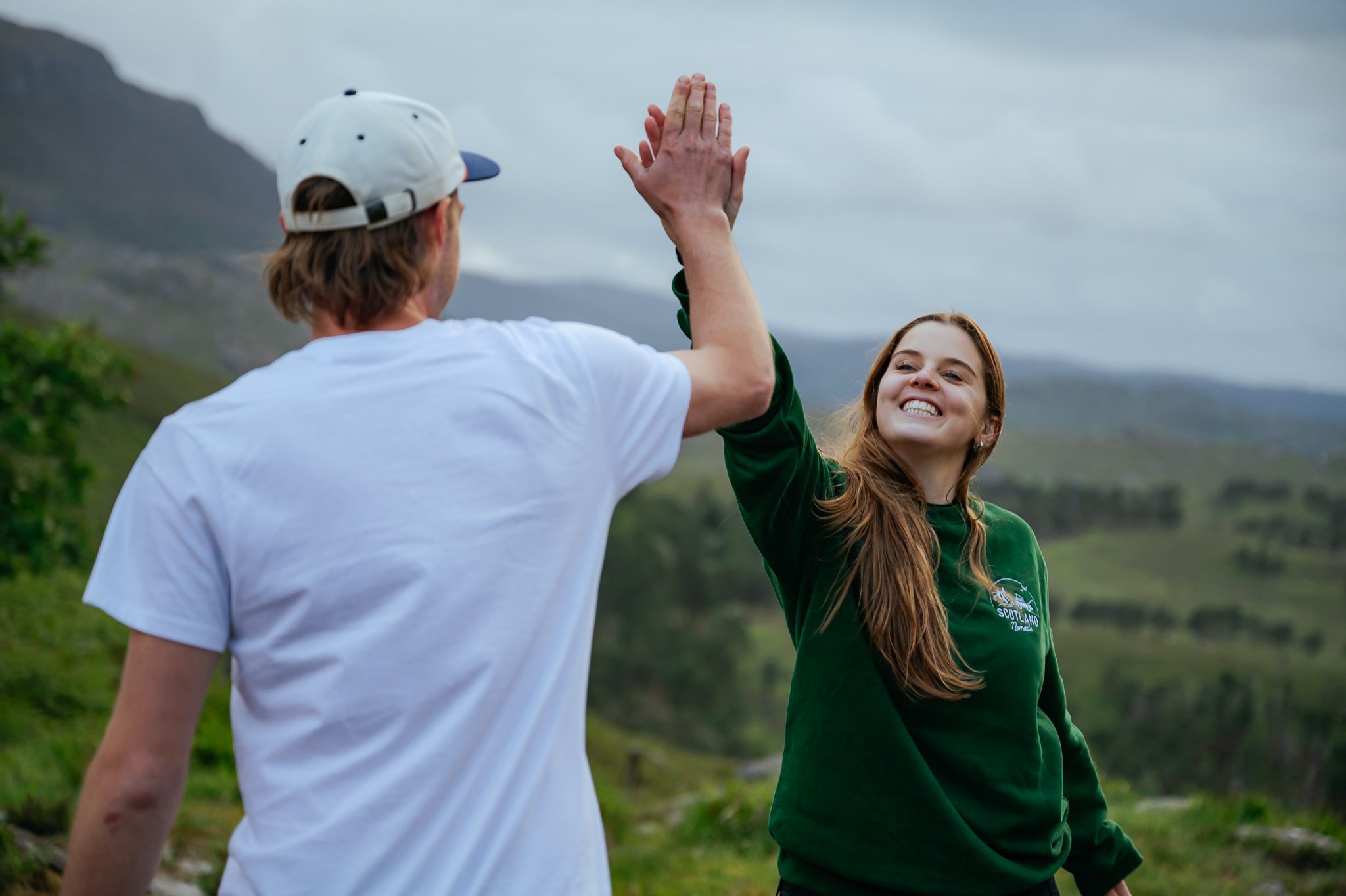 Happy high five Scotland road trip SUV Isle of Skye