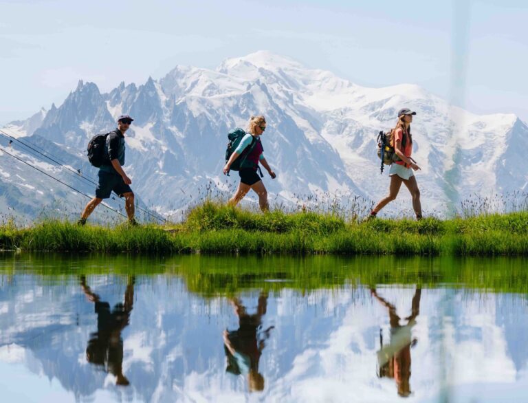 3 people walking together on the Mont Blanc Trail Mont Blanc Circuit