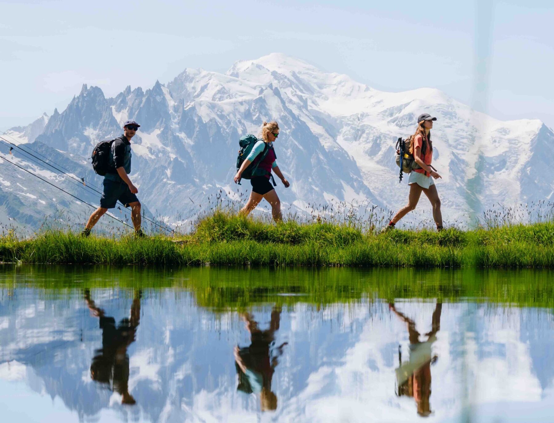 3 people walking together on the Mont Blanc Trail Mont Blanc Circuit