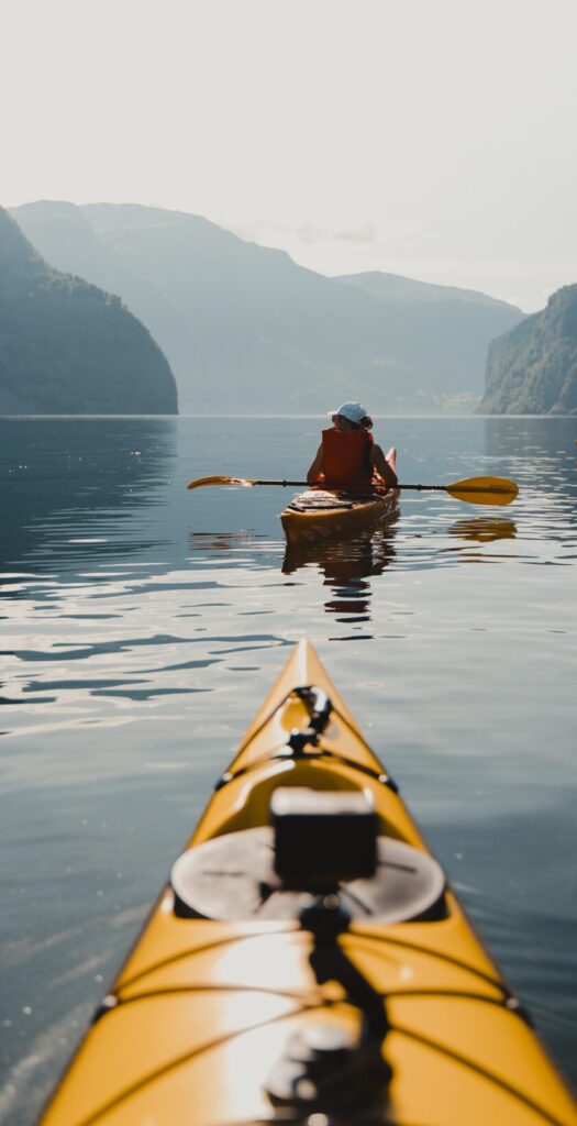 girl paddling in fjords - Kayaking - Norway fjord - hiking in Norway - kayaking - from Brussels airport