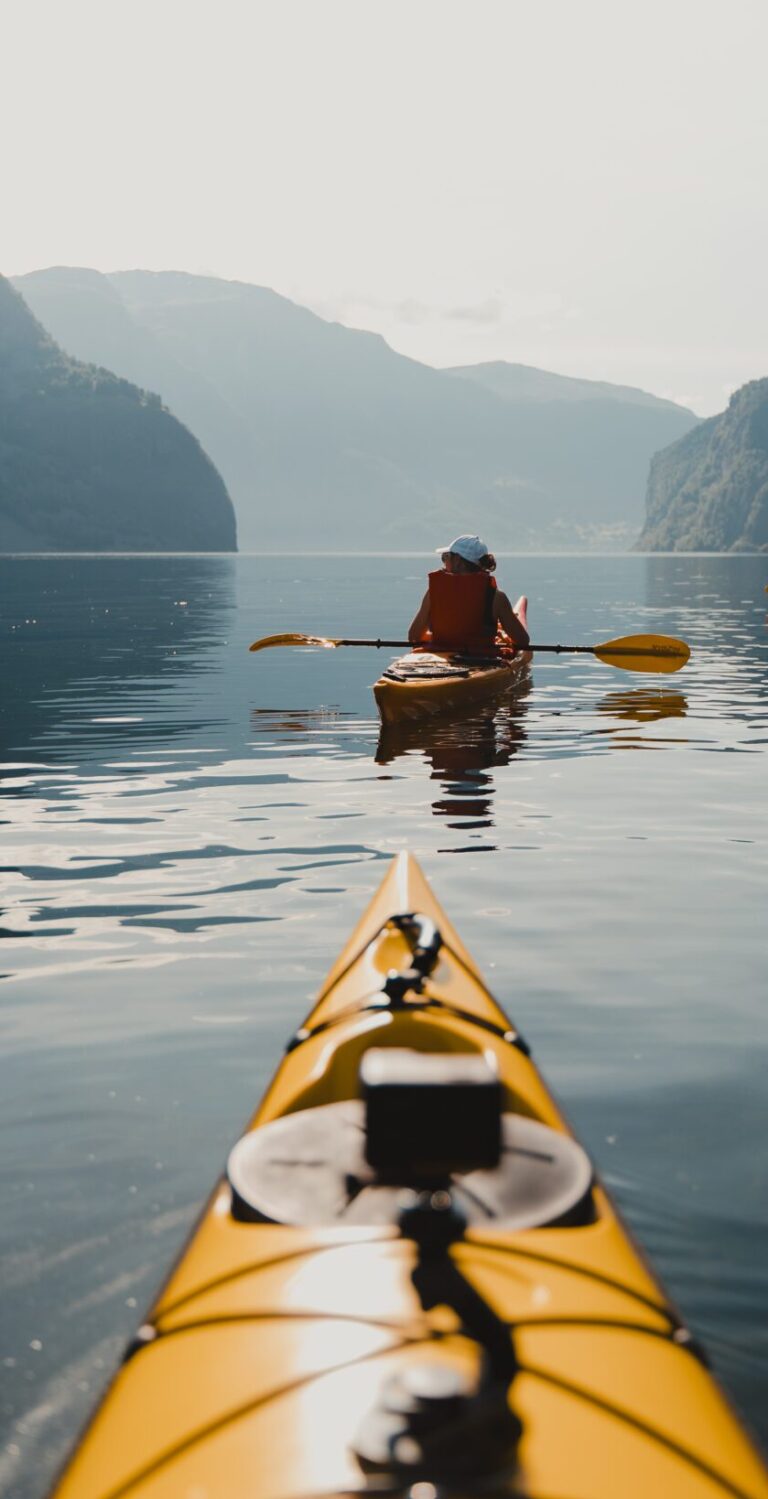 girl paddling in fjords - Kayaking - Norway fjord - hiking in Norway - kayaking - from Brussels airport
