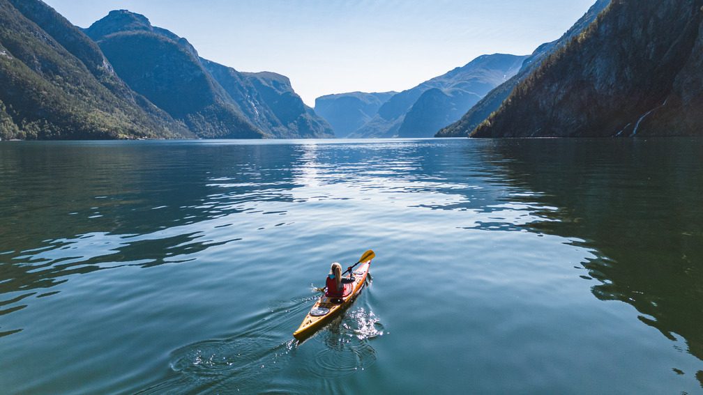 Woman kayaking in the fjords in Norway - Kayaking - Norway fjord - hiking in Norway - kayaking - from Brussels airport