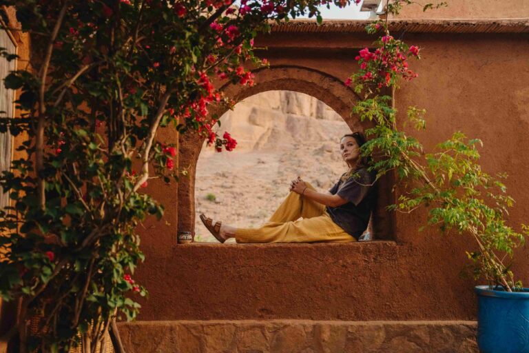 Woman sitting in a window in Morocco